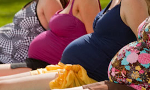 Pregnant women sunbathing